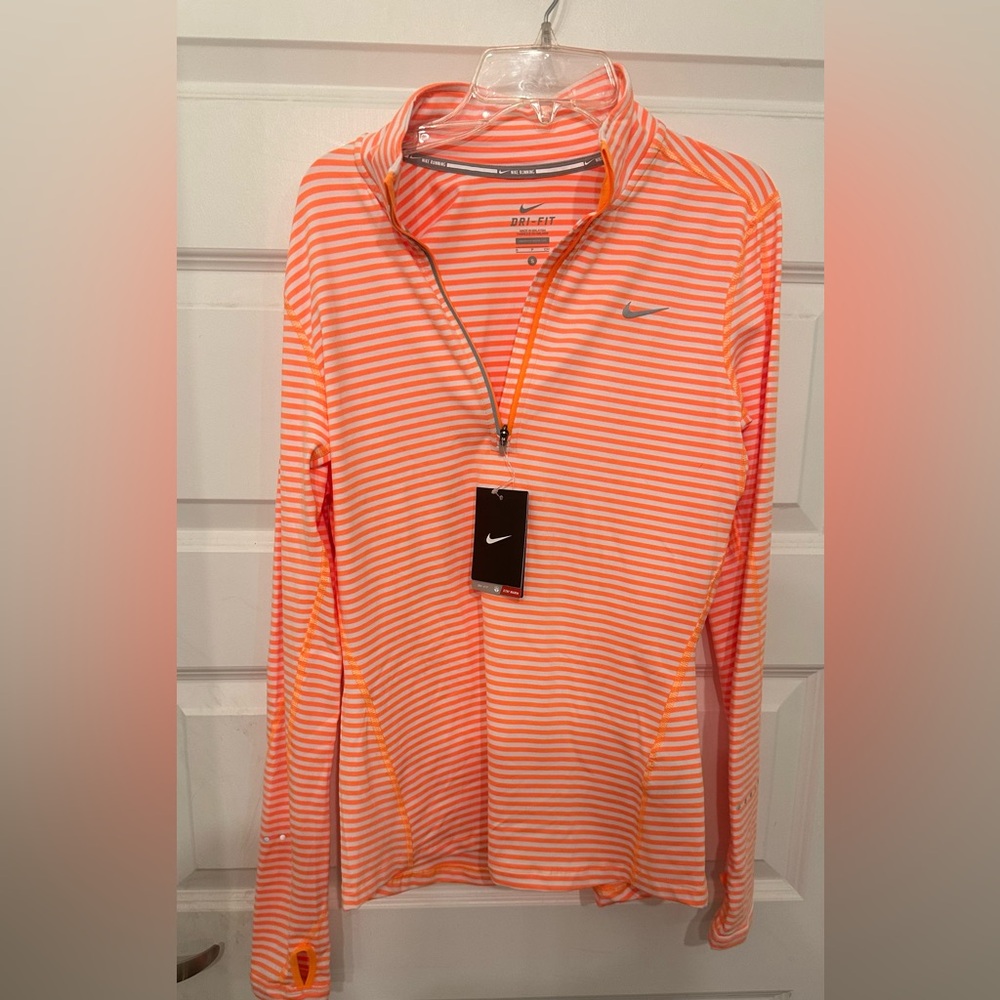 Orange and white Nike dri-fit running half zip.